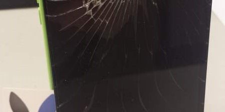 Smashed screen on an iPhone 5C green