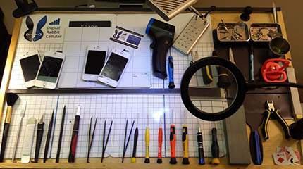 Digital Rabbit Cellular Phone and Tablet Repair Tools on Work Desk
