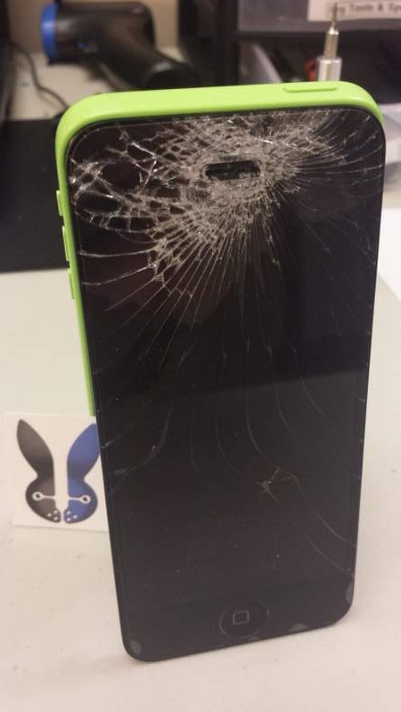 Smashed screen on an iPhone 5C green